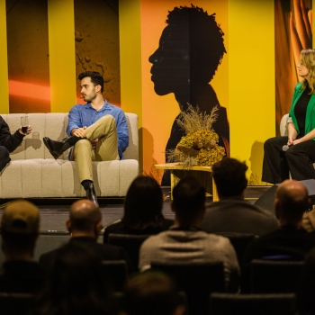 Tarra van Amerongen, Matthew Blode, and Trudi Boatwright speaking on a panel at Product Outlook 2025 in Melbourne, seated on stage with a live audience.