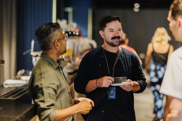 A photograph of DO Design Leadership attendees networking