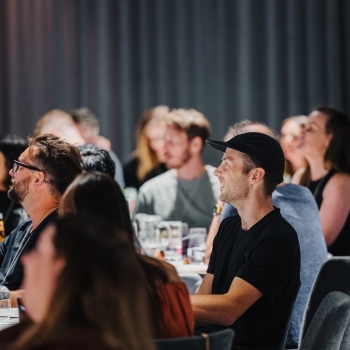 A photograph of attendees at DO Design Leadership