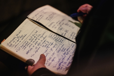 Close-up of a notebook filled with handwritten notes taken by an attendee during a Design Outlook 2024 session.
